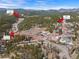 An aerial view showcases the community's location near Evergreen Lake, Downtown Evergreen and 28110 Meadow Dr at 28110 Meadow Dr, Evergreen, CO 80439