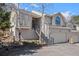 Charming home featuring multiple stories, stairs to the front door, and an attached two car garage at 28110 Meadow Dr, Evergreen, CO 80439