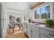 Bright kitchen features a breakfast nook with lovely windows and stainless steel appliances at 28110 Meadow Dr, Evergreen, CO 80439