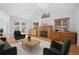 Bright living room with fireplace and access to the outdoor patio at 28110 Meadow Dr, Evergreen, CO 80439