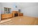 Bright living room with wooden floors, a fireplace, and built-in cabinets for storage and style at 28110 Meadow Dr, Evergreen, CO 80439