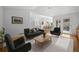 Bright living room featuring hardwood floors, comfortable seating, and stylish decor at 28110 Meadow Dr, Evergreen, CO 80439