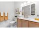 Stylish bathroom with modern fixtures, patterned tile flooring, and a decorative mirror at 2647 N High St, Denver, CO 80205