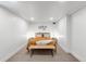 Modern bedroom with carpeted floors, neutral walls, and minimal decor for a cozy retreat at 2647 N High St, Denver, CO 80205