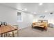 Bright bedroom featuring natural light, a wooden desk, and a comfortable bed for rest and study at 2647 N High St, Denver, CO 80205