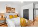 Inviting bedroom with neutral tones, a comfortable bed, and natural wood accents at 2647 N High St, Denver, CO 80205