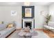Bright living room showcasing a fireplace, stylish decor, and an inviting open space at 2647 N High St, Denver, CO 80205