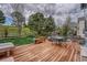 Inviting back deck with an outdoor dining set, charming landscape, and a hammock, perfect for relaxation and entertainment at 5934 S Yampa St, Aurora, CO 80016