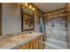 Bathroom with a single sink vanity and a tiled shower and neutral decor at 5934 S Yampa St, Aurora, CO 80016
