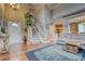 Bright and open foyer with hardwood floors, soaring ceilings, and a staircase leading to the second floor at 5934 S Yampa St, Aurora, CO 80016