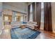 Spacious living room featuring hardwood floors, high ceilings, large windows, and comfortable seating at 5934 S Yampa St, Aurora, CO 80016