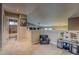 Neutral decor loft featuring a kitchen play area and an adjacent bathroom at 5934 S Yampa St, Aurora, CO 80016