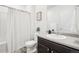 Bathroom featuring a shower/tub, modern fixtures, and ample counter space at 2122 Opal Ave, Brighton, CO 80603