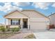 Inviting single Gathering home featuring stone accents, a covered porch, and attached two-car garage at 2122 Opal Ave, Brighton, CO 80603