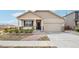 Charming single-Gathering home featuring a two-car garage, quaint front porch, and landscaped front yard at 2122 Opal Ave, Brighton, CO 80603