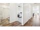 Hallway view showcasing bathroom, bedroom and entryway at 2122 Opal Ave, Brighton, CO 80603