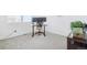Bright home office space with neutral carpet and natural light at 2122 Opal Ave, Brighton, CO 80603
