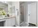 Bright bathroom featuring a stand up shower and vanity with granite counters at 1668 Rosemary Dr, Castle Rock, CO 80109
