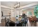 Warm dining area with a table, study space, and hardwood floors at 1668 Rosemary Dr, Castle Rock, CO 80109