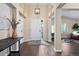 Bright foyer with tall ceilings and a view into the living room at 1668 Rosemary Dr, Castle Rock, CO 80109