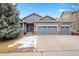 Charming home featuring a two-car garage and well-maintained landscaping at 1668 Rosemary Dr, Castle Rock, CO 80109