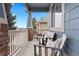 Inviting front porch with comfortable seating area perfect for relaxing and enjoying the outdoors at 1668 Rosemary Dr, Castle Rock, CO 80109
