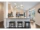 Open kitchen with a large granite island, stainless steel appliances, and light wood cabinets, great for entertaining at 1668 Rosemary Dr, Castle Rock, CO 80109