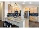 Spacious kitchen with stainless steel appliances, granite countertops, and a breakfast bar with barstool seating at 1668 Rosemary Dr, Castle Rock, CO 80109