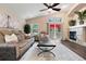 Spacious living room with vaulted ceilings, comfortable seating, and a view of the outdoor deck at 1668 Rosemary Dr, Castle Rock, CO 80109