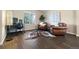 Cozy home office featuring natural light, hardwood floors, and comfortable seating at 1668 Rosemary Dr, Castle Rock, CO 80109