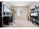 Home office with desk, shelving and large window at 1668 Rosemary Dr, Castle Rock, CO 80109