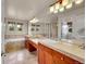 Bathroom boasts double sinks, large mirrors, and a separate tub and shower at 24965 E Roxbury Pl, Aurora, CO 80016