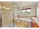 Bathroom features a separate tub and shower and large windows for natural light at 24965 E Roxbury Pl, Aurora, CO 80016