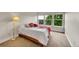 Bright bedroom with natural light, hardwood frame, and cozy linens is perfect for relaxing at 24965 E Roxbury Pl, Aurora, CO 80016