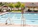 Large community pool with lane markers and ample seating, perfect for swimming and relaxation at 24965 E Roxbury Pl, Aurora, CO 80016