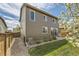 Rear exterior showcasing well-maintained yard, patio, and exterior details at 25621 E Cedar Pl, Aurora, CO 80018