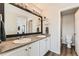 Elegant bathroom with double sinks, a large mirror, and modern finishes at 25621 E Cedar Pl, Aurora, CO 80018