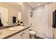 Bathroom featuring a shower-tub combo and ample counter space at 25621 E Cedar Pl, Aurora, CO 80018