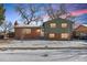 Charming two-story home with brick and siding exterior, winter landscape, and cozy curb appeal at 950 Laurel St, Broomfield, CO 80020