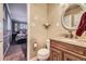 Bathroom featuring a decorative mirror, granite countertop, and view to the nearby bedroom at 5485 E Bails Dr, Denver, CO 80222
