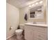 Bathroom featuring white cabinets, updated fixtures, and neutral paint at 5485 E Bails Dr, Denver, CO 80222