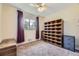 Bedroom featuring carpet, storage cabinet, a window with decorative curtains, and a ceiling fan at 5485 E Bails Dr, Denver, CO 80222