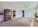 Spacious living room featuring plush carpeting and modern lighting at 5485 E Bails Dr, Denver, CO 80222