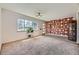 Bright living room featuring large windows and eye-catching accent wall at 5485 E Bails Dr, Denver, CO 80222