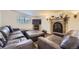 Cozy basement living room featuring a fireplace and comfortable seating at 5485 E Bails Dr, Denver, CO 80222