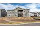 Stunning back exterior view featuring a second story balcony and meticulously kept landscaping at 6657 S Kline Way, Littleton, CO 80127