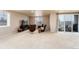 Large, carpeted basement with ample natural light, a fireplace and walk out to patio at 6657 S Kline Way, Littleton, CO 80127