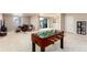 Spacious carpeted basement with foosball table and walk out to patio at 6657 S Kline Way, Littleton, CO 80127