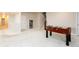 Finished basement space featuring neutral carpet and a foosball table at 6657 S Kline Way, Littleton, CO 80127