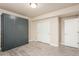Multi-use flex space with a murphy bed, closet and white paneled doors at 6657 S Kline Way, Littleton, CO 80127